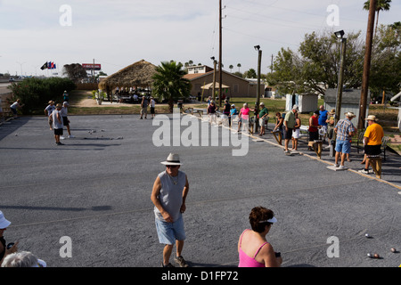 Retirees playing a game of Petanque at Sleepy Valley Resort in Mission, Texas, USA Stock Photo