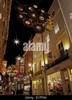 Christmas decorations on Carnaby Street, London, UK on 18th December 2012 showing huge 3D spheres suspended throughout Carnaby containing gold and silver vinyl records. Carnaby Street is world famous for its music heritage as well as its fashion heritage and this year’s Christmas installation is a collaboration with The Rolling Stones in celebration of their 50th Anniversary. Stock Photo