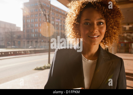 Smiling mixed race businesswoman Stock Photo