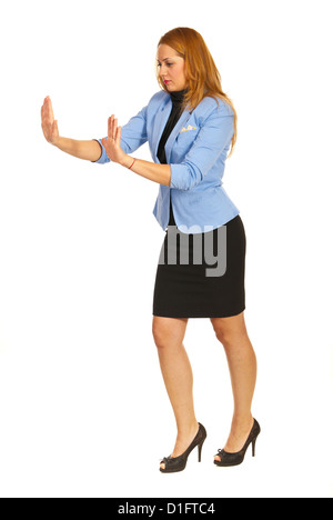 Business woman pushing something imaginary isolated on white background Stock Photo