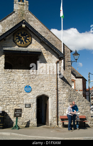 couple studying guide book outside llantwit major town hall vale of glamorgan south wales uk Stock Photo