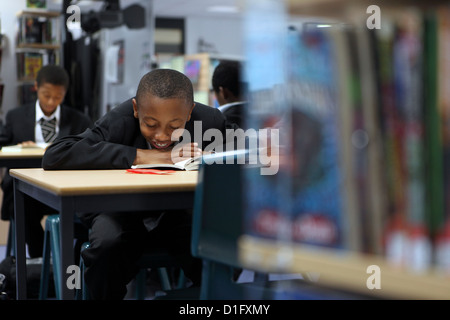 Afro-Caribbean boys studying reading in library Stock Photo