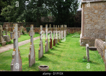 Rows of headstones in churchyard at Saint Richard's Church. Burton Park, Duncton, West Sussex. England Stock Photo