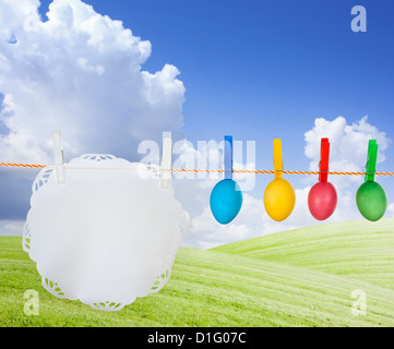 Colorful easter eggs creative concept hanging on a string Stock Photo