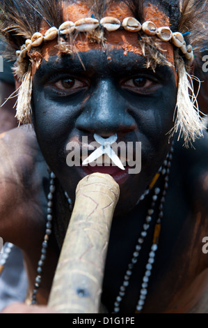 Colourfully dressed and face painted local tribes celebrating the traditional Sing Sing in the Highlands, Papua New Guinea Stock Photo