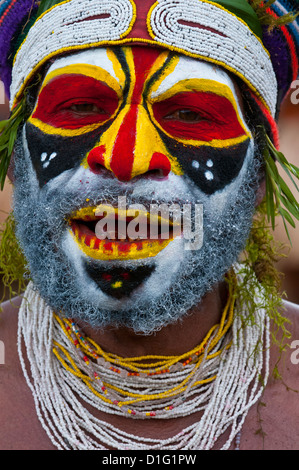Colourfully dressed and face painted local tribes celebrating the traditional Sing Sing in the Highlands, Papua New Guinea Stock Photo