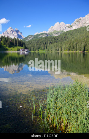 A Serene Scene At Lago Di Misurina Where A Traveler Admires The a-serene-scene-at-lago-di-misurina-where-a-traveler-admires-the