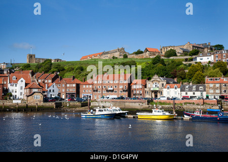 Boats in the Upper Harbour below St. Marys Church, Whitby, North Yorkshire, Yorkshire, England, United Kingdom, Europe Stock Photo