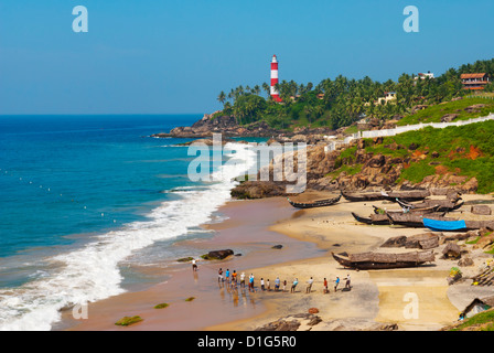 View to the Lighthouse with fishermen, Kovalam, Kerala, India, Asia Stock Photo