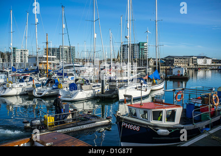 Moored yachts on a sunny winter's day in Sutton Harbour on the Barbican, Plymouth, Devon. UK Stock Photo