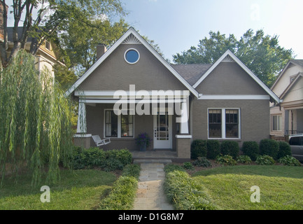 Front exterior of a one story bungalow with white trim at Nashville; Tennessee; USA Stock Photo