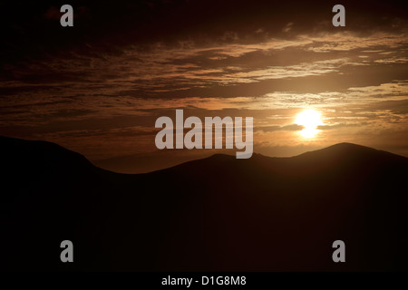Sunset, Altocumulus Stratiformis Clouds, over mountains, Lake District National Park, Cumbria County, England, UK Stock Photo