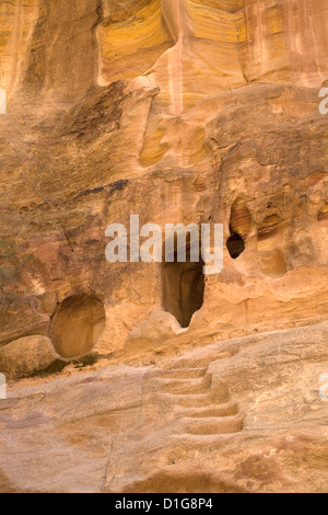 Caves in the rock faces which were used as homes for the Bedouin surrounding Petra, Jordan. Stock Photo