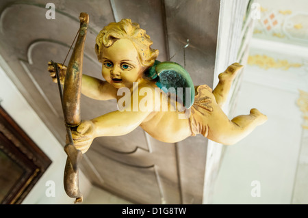 Wooden Baroque Angel with bow and arrow Stock Photo