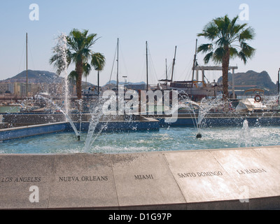 Fountain in the harbour of Aguilas Murcia Spain with names of destinations in 'The new world' Stock Photo