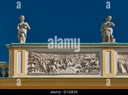 Battle of Vienna (1683) bas relief scenes, statues of ancient goddesses at attic on alcove tower, Wilanów Palace, Warsaw, Poland Stock Photo
