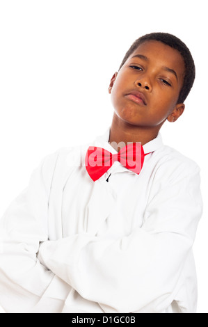 Portrait of serious child in scientist lab coat and red bow tie, isolated on white background. Stock Photo