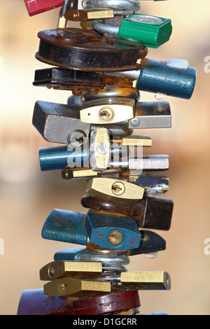 group of various padlock locked on stick Stock Photo