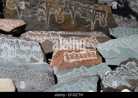 detail of written mantra on buddhist mani stones Stock Photo