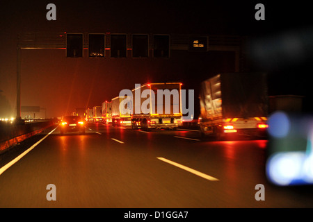 Cars are driving at night on the german Autobahn. Photo: Frank May Stock Photo