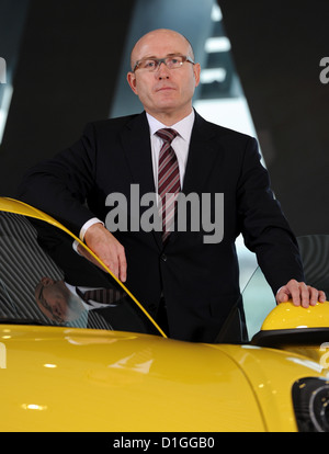 The head of sales and market of sports car manufacturer Porsche AG, Bernhard Maier, poses with a Porsche Cayman at the Porsche Museum in Stuttgart, Germany, 18 December 2012. Photo: Bernd Weissbrod Stock Photo