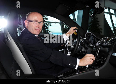 The head of sales and market of sports car manufacturer Porsche AG, Bernhard Maier, poses with a Porsche Cayman at the Porsche Museum in Stuttgart, Germany, 18 December 2012. Photo: Bernd Weissbrod Stock Photo