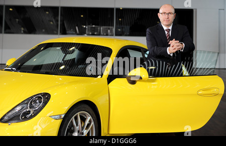 The head of sales and market of sports car manufacturer Porsche AG, Bernhard Maier, poses with a Porsche Cayman at the Porsche Museum in Stuttgart, Germany, 18 December 2012. Photo: Bernd Weissbrod Stock Photo