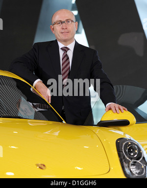 The head of sales and market of sports car manufacturer Porsche AG, Bernhard Maier, poses with a Porsche Cayman at the Porsche Museum in Stuttgart, Germany, 18 December 2012. Photo: Bernd Weissbrod Stock Photo