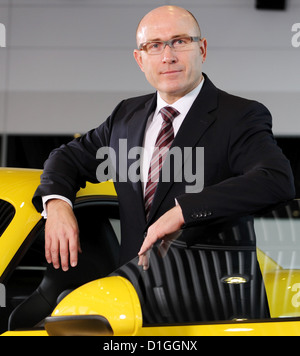 The head of sales and market of sports car manufacturer Porsche AG, Bernhard Maier, poses with a Porsche Cayman at the Porsche Museum in Stuttgart, Germany, 18 December 2012. Photo: Bernd Weissbrod Stock Photo