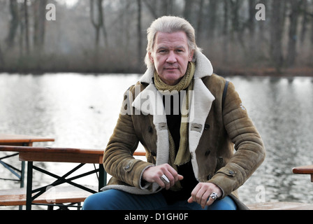 Irish singer and composer Johnny Logan sits at Kleinheesloh Lake in Munich, Germany, 19 December 2012. Photo: Frank Leonhardt Stock Photo