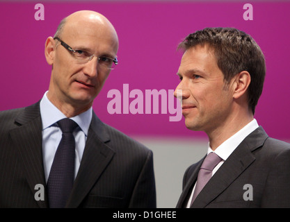 Deutsche Telekom CEO Rene Obermann (R) and CFO Timotheus Hoettges (L) talk ahead of the German telecommunication giant's general meeting in Cologne, Germany, 03 May 2010. Photo: OLIVER BERG Stock Photo