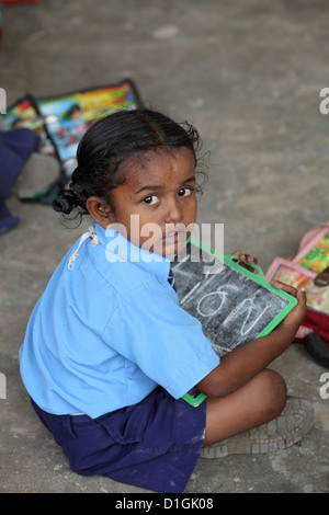 Vijayawada, India, a little schoolgirl with her blackboard in the classroom Stock Photo