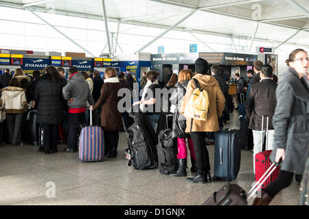 21st December 2012. London Stansted Airport, Essex, UK. This is believed to be the British Airways busiest travelling day of the Christmas Holidays. Passengers queue at check-in at Stansted as they make their way across the UK and Europe by air. Stock Photo