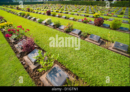 Lines of hundreds of graves at Kanchanaburi War Cemetery, Thailand, Southeast Asia, Asia Stock Photo