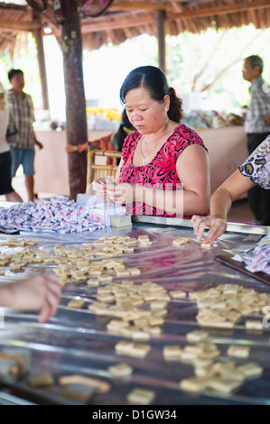 Woman making sweets, Can Tho, Mekong Delta, Vietnam, Indochina, Southeast Asia, Asia Stock Photo