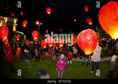 A release of 1000 flying lanterns taking Xmas letters off (Vichy - France). Sky lanterns by night. Stock Photo
