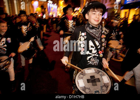 Brighton, UK. Friday 21st December 2012. Skulll Drummery drum group. Burning the Clocks has been a Brighton tradition for almost two decades. This event takes place on the winter solstice, the shortest day of the year. A 2,000-strong parade winds its way through the streets and people pass their handmade paper and willow lanterns – filled symbolically with their hopes and dreams – into a blazing bonfire to “burn the clocks” and welcome in the new longer day. Stock Photo
