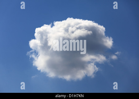 Single fluffy cloud in a clear blue sky. Stock Photo