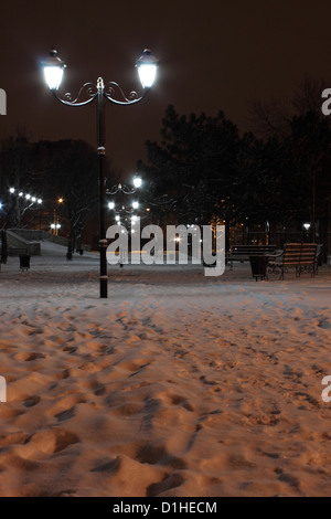 lanterns in park at winter night Stock Photo
