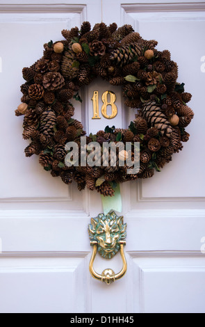 Christmas wreath on front door Stock Photo