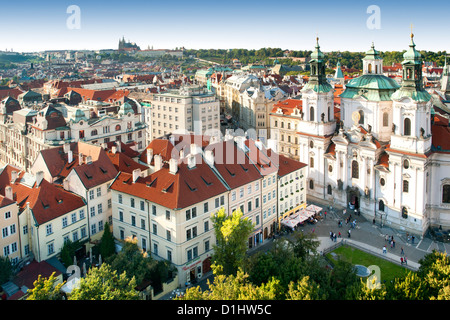 View of St Nicholas' church and old town rooftops in Prague, the capital of the Czech Republic. Stock Photo