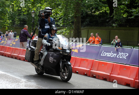 Television camera on a motorcycle during the Triathlon.London 2012 Olympics.Photo by Alan Edwards Stock Photo