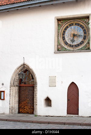 Clock on the wall of the Church of the Holy Spirit in Tallinn, the capital of Estonia. Stock Photo