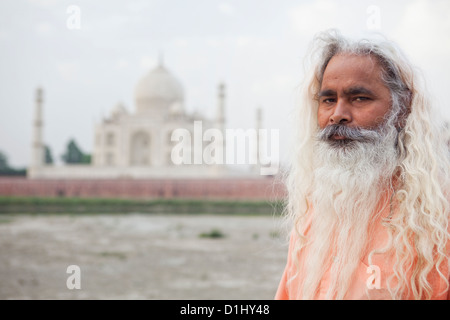 Indian Holy Man In Front Of Taj Mahal, Agra, Uttar Pradesh, India Stock Photo