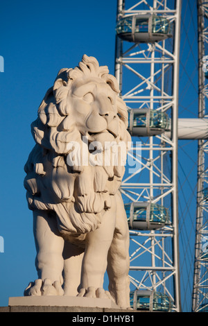 The South Bank Lion stone sculpture with London Eye Millennium Ferris Wheel in background London England UK Stock Photo