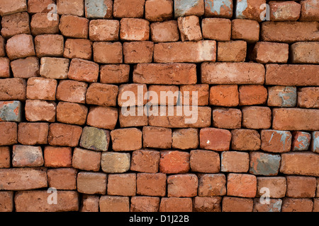 Pile of hand made bricks pattern. India Stock Photo