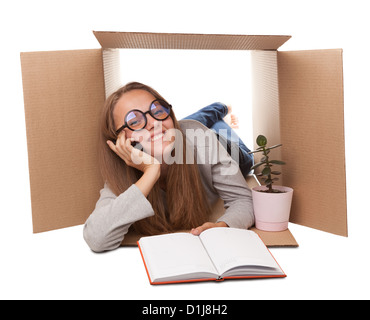 girl has retired to a cardboard box Stock Photo