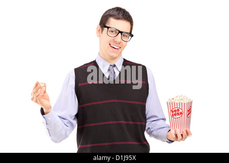 Smiling man eating popcorn isolated on white background Stock Photo