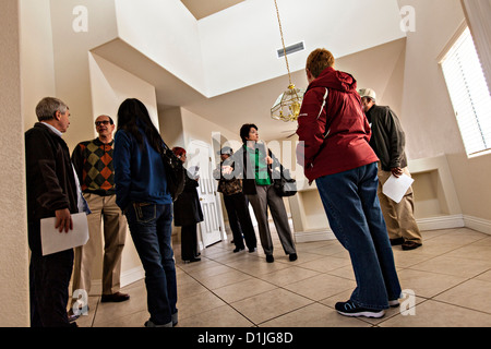 Buyers view a foreclosed home in Las Vegas, NV. Stock Photo