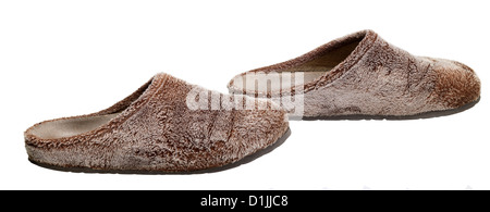 a pair of brown fluffy slippers in white back Stock Photo